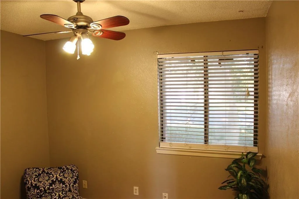 Vaulted Ceilings, Cozy Fireplace & No Carpet | Charming Round Rock 1-Story photo 16