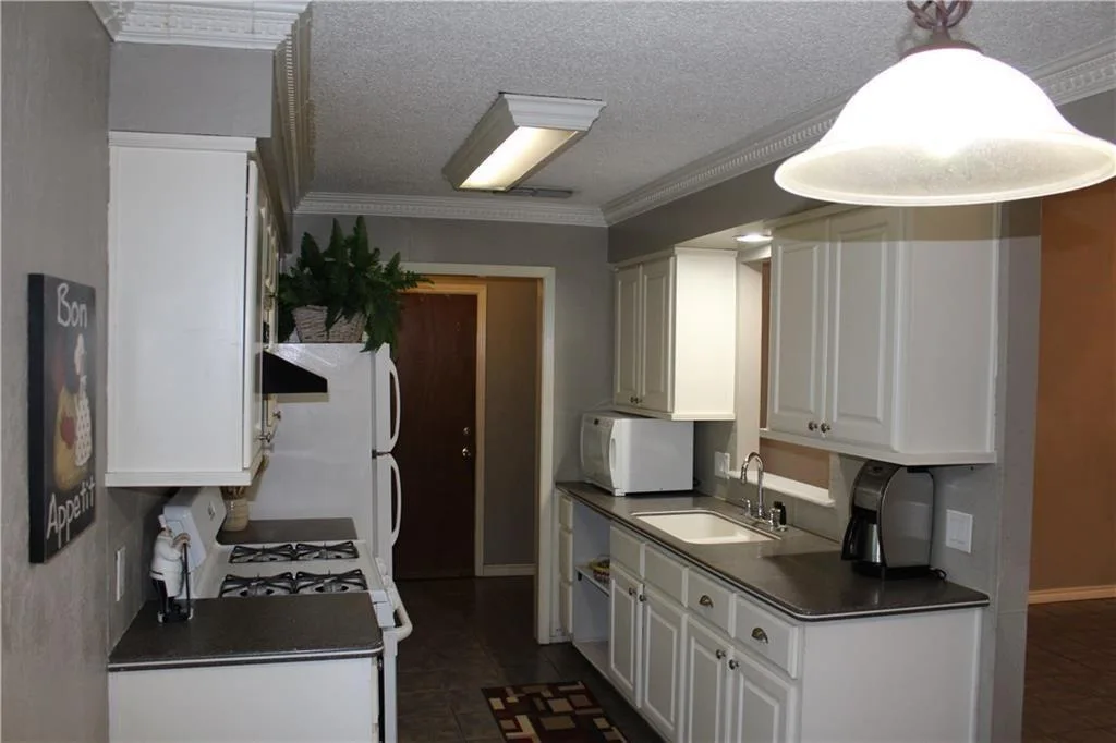 Vaulted Ceilings, Cozy Fireplace & No Carpet | Charming Round Rock 1-Story photo 7