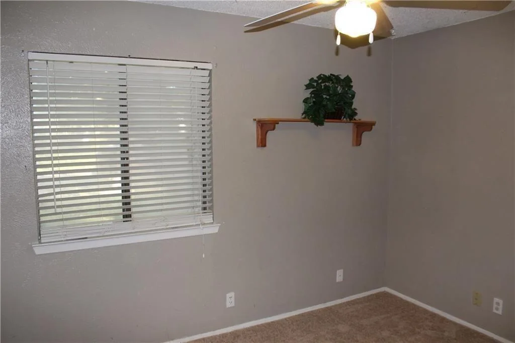 Vaulted Ceilings, Cozy Fireplace & No Carpet | Charming Round Rock 1-Story photo 17