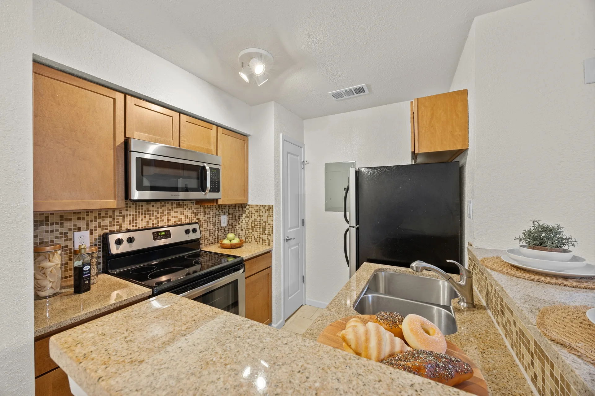 Top-Floor Condo Retreat in Gated Ivy Condos | Private Balcony + Tree-Filled Views photo 13